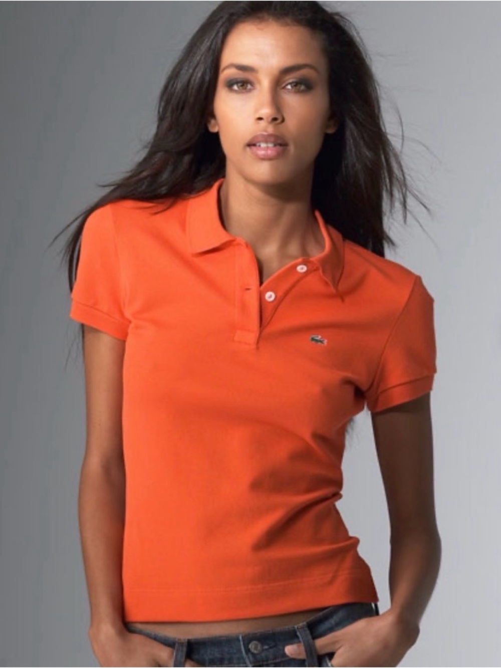 Lacoste Women’s Medium Slim-Fit Orange Short Sleeve Piqué Polo. Small/Medium.